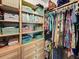 Walk-in closet with built-in organizers, shelves with baskets, and ample hanging space at 10115 Long Branch St, Port Charlotte, FL 33981