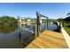 Dock with boat lift on canal offering direct access to waterfront adventures and relaxation in a convenient setup at 10115 Long Branch St, Port Charlotte, FL 33981