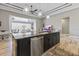This kitchen shows a beautiful island with stainless steel appliances and modern lighting fixtures at 10115 Long Branch St, Port Charlotte, FL 33981