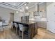 Spacious kitchen featuring a large island, stainless steel appliances, and sleek countertops at 10115 Long Branch St, Port Charlotte, FL 33981