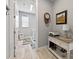 Convenient laundry room featuring front loading washer and dryer with counter space at 10115 Long Branch St, Port Charlotte, FL 33981