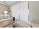 Bright living room featuring sliding shade panels, a cozy sofa, and stylish decor at 10115 Long Branch St, Port Charlotte, FL 33981