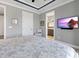 This main bedroom features a calming decor with a TV and access to an ensuite bathroom at 10115 Long Branch St, Port Charlotte, FL 33981