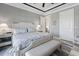 Relaxing main bedroom with two nightstands and a large door to the hallway and bathroom at 10115 Long Branch St, Port Charlotte, FL 33981