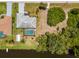 Aerial view highlights home featuring private pool, and scenic waterway at 10182 Charlemont Ave, Englewood, FL 34224