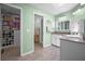 Bathroom with a vanity, shower, and linen closet for storage, ensuring a functional space at 10182 Charlemont Ave, Englewood, FL 34224