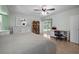 Well-lit bedroom with a ceiling fan, access to the pool area, and dresser at 10182 Charlemont Ave, Englewood, FL 34224