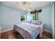 Bright bedroom showcasing hardwood floors, ceiling fan, and a cozy atmosphere at 10182 Charlemont Ave, Englewood, FL 34224