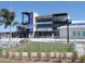 Exterior of baseball field complex with signs that read, 