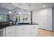Bright kitchen with an island, lots of cabinets, and a window overlooking the pool at 10182 Charlemont Ave, Englewood, FL 34224