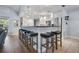 Modern kitchen featuring a large island with barstool seating and plenty of countertop space at 10182 Charlemont Ave, Englewood, FL 34224