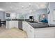Spacious kitchen featuring ample counter space, stainless steel dishwasher, and modern finishes at 10182 Charlemont Ave, Englewood, FL 34224