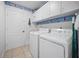 Well-equipped laundry room with modern appliances and storage cabinets for organization at 10182 Charlemont Ave, Englewood, FL 34224