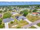 Aerial view of a well-maintained home with lush green lawn and mature trees at 1035 Riggs St, Port Charlotte, FL 33952