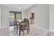 Comfortable dining area featuring a view of the pool through the sliding glass door at 1035 Riggs St, Port Charlotte, FL 33952