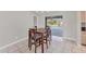 Cozy dining area with a view of the pool and sliding doors to the outside patio at 1035 Riggs St, Port Charlotte, FL 33952