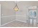 Dining room with tile floors and chandelier at 1035 Riggs St, Port Charlotte, FL 33952