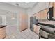 Efficient kitchen layout with ample storage, granite countertops, and stainless steel appliances at 1035 Riggs St, Port Charlotte, FL 33952