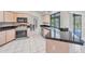 Bright, well lit kitchen featuring granite counters and a view of the pool at 1035 Riggs St, Port Charlotte, FL 33952