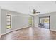 Living room with tile floors and access to lanai and pool at 1035 Riggs St, Port Charlotte, FL 33952