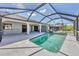 Inviting screened-in pool with a spacious patio area for outdoor living at 1035 Riggs St, Port Charlotte, FL 33952
