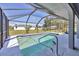 Inviting screened-in pool area with clear water and a well-maintained deck at 1035 Riggs St, Port Charlotte, FL 33952
