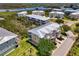 Stunning aerial view of townhouses with metal roofs and nearby lake at 10411 Coral Landings Ln # 85, Placida, FL 33946