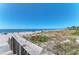 Scenic beach view from a wooden walkway at 10411 Coral Landings Ln # 85, Placida, FL 33946