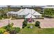 Charming community clubhouse with flag pole and manicured landscaping at 10411 Coral Landings Ln # 85, Placida, FL 33946
