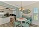 Open concept dining area leading to the kitchen, offering ample space for entertaining at 10411 Coral Landings Ln # 85, Placida, FL 33946