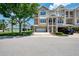 Beautiful multi-story townhouse with front yard and balconies near mature trees, and a two-car garage at 10411 Coral Landings Ln # 85, Placida, FL 33946