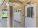 Exterior image featuring the front door and two-car garage on a well-maintained property at 10411 Coral Landings Ln # 85, Placida, FL 33946