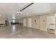 Spacious garage with high ceilings, utility connections, and access to other rooms at 10411 Coral Landings Ln # 85, Placida, FL 33946