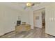 Bright home office with ceiling fan and desk, with an open doorway leading to another room at 10411 Coral Landings Ln # 85, Placida, FL 33946