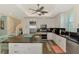 Bright open concept kitchen with granite countertops, center island, and stainless steel appliances at 10411 Coral Landings Ln # 85, Placida, FL 33946