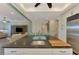 Spacious kitchen with white cabinets, dark countertops, and stainless steel appliances at 10411 Coral Landings Ln # 85, Placida, FL 33946