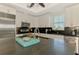 Bright kitchen featuring white cabinets, stainless steel appliances, and dark countertops at 10411 Coral Landings Ln # 85, Placida, FL 33946