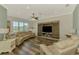 Bright living room featuring hardwood floors, recessed lighting, and a large window at 10411 Coral Landings Ln # 85, Placida, FL 33946