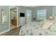 Beautiful main bedroom with balcony access, TV, and ensuite bathroom at 10411 Coral Landings Ln # 85, Placida, FL 33946