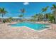 Stunning swimming pool surrounded by palm trees, providing a refreshing and tropical experience at 10411 Coral Landings Ln # 85, Placida, FL 33946