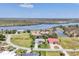 Stunning aerial view of waterfront homes and lush landscaping in a beautiful neighborhood at 11 Amberjack Ln, Placida, FL 33946