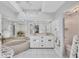 Bright bathroom features a soaking tub, double vanity, tiled floors, and a walk-in shower at 11 Amberjack Ln, Placida, FL 33946