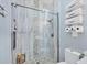 Updated bathroom featuring a tiled walk-in shower, toilet and decorative towels at 11 Amberjack Ln, Placida, FL 33946
