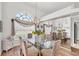 Formal dining room featuring a glass table, large windows, and elegant decor at 11 Amberjack Ln, Placida, FL 33946