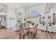 Formal dining room featuring a glass table, large windows, and elegant decor at 11 Amberjack Ln, Placida, FL 33946