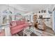 Bright living room with stylish furnishings, cathedral ceiling, and views to the kitchen at 11 Amberjack Ln, Placida, FL 33946