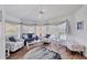Bright, coastal-themed living room with comfortable seating, hardwood floors and multiple windows at 11 Amberjack Ln, Placida, FL 33946