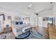 Bright main bedroom boasts vaulted ceiling, a ceiling fan, and hardwood floors at 11 Amberjack Ln, Placida, FL 33946