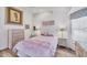 Beach-themed bedroom with a flamingo-themed comforter and light wood furniture at 11 Amberjack Ln, Placida, FL 33946
