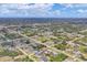 Expansive aerial shot of a residential area with numerous homes nestled among lush trees and quiet streets at 11008 Waterford Ave, Englewood, FL 34224